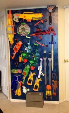 there are many toys on the pegboard in this room