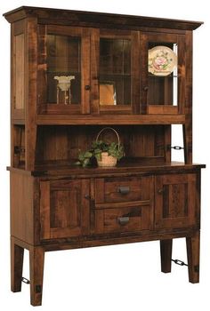 a wooden hutch with glass doors on the front and bottom shelf, holding plants