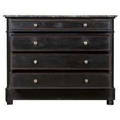 an antique chest of drawers with marble top and metal pulls on the bottom, against a white background