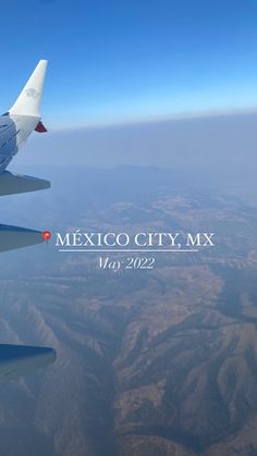 the view from an airplane window shows mountains and blue sky in mexico city, may 2012