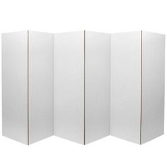 a white room divider with four panels