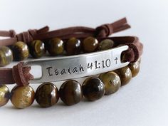 "Wear your favorite inspirational words on your wrist to remind yourself of what matters most to you every day. :) This unisex bracelet features the bible verse \"Isaiah 41:10\", hand stamped into non tarnish stainless steel, with a small cross at the end of the verse. The soft brown faux suede leather cord is adjustable and fits most wrist sizes. You can choose any other short verse you would like under \"personalization\", up to 10 letters works best with this design, but I can squeeze up to 1 Spiritual Leather Bracelet For Everyday, Spiritual Everyday Leather Bracelet, Spiritual Brown Wrap Bracelet For Friendship, Inspirational Adjustable Bracelets For Personalized Gifts, Inspirational Custom Name Adjustable Bracelet, Inspirational Engraved Adjustable Name Bracelet, Inspirational Personalized Faith Name Bracelet, Inspirational Engraved Name Bracelet, Adjustable, Brown Hand Stamped Bracelets For Everyday