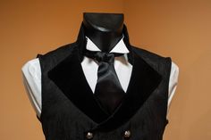 Stylish double-breasted men's black vest made of high-quality jacquard with viscose lining. Lapels and collar - from cotton velvet. Decorated with dark silver buttons. The waist can be adjusted from the back. The collar can be worn as a stand or as a turn-down. Will be perfect for victorian or vampire wedding, photoset, also it could be worn as a part of a historical costume. The vest is made to order. Please, tell us the following measurements: - Height - Chest - Waist - Hips ♥ See all costumes Classic Black Vest For Party, Classic Black Party Vest, Gothic Black Vest For Costume, Black Gothic Costume Vest, Black Elegant Vest For Costume, Elegant Black Vest For Costume, Mens Black Vest, Vampire Wedding, Wedding Gothic