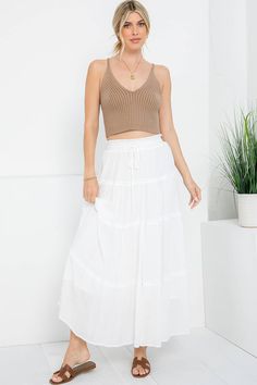 Introducing our Coastal Tiered Maxi Skirt, designed to bring the essence of seaside charm to your wardrobe. Crafted with care and inspired by the tranquility of coastal living, this skirt is the epitome of effortless elegance and relaxed sophistication. Pair it with a simple tank top for a laid-back beach look, or wear it for chillier days with our beachcomber sweater or cardigan. Whether you're exploring new destinations or simply enjoying a leisurely day in town, our Coastal Tiered Maxi Skirt promises to add a touch of seaside charm to any ensemble. Dive into relaxation and style with this versatile wardrobe staple. Details: 100% Polyester Fully Lined Elastic Stretch Waistband w/ Tie True to Size Fit Flowy Cotton Skirt For Beach Season, Breezy Beach Maxi Skirt, Breezy Beach Maxi Skirt With Relaxed Fit, Breezy Relaxed Maxi Skirt For Beach, Relaxed Beach Season Maxi Skirt For Day Out, Relaxed Maxi Skirt For Beach Season, Casual Flowy Maxi Skirt For Beach Season, Relaxed Maxi Skirt For Beach Season Day Out, Casual Lined Maxi Skirt For Beach Season