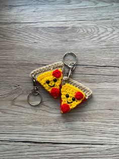 a crocheted keychain shaped like a slice of pizza with a pikachu face on it