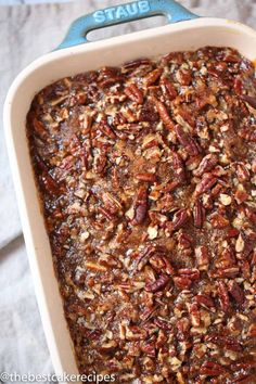 a casserole dish with pecans in it