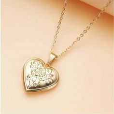 This Stunning Necklace Features A Beautiful Heart-Shaped Locket On A Delicate Chain, Perfect For Adding A Touch Of Elegance To Any Outfit. The Locket Is Made Of High-Quality Stainless Steel And Comes In A Gold Color, Making It A Timeless Addition To Your Jewelry Collection. With A Stylish Chain And A Charming Pendant Shape, This Necklace Is Perfect For Any Occasion. The Chain Measures Approx 9.5 Inches, And The Locket Measures Approx 1.25 Inches From Top To Bottom. There Is Also A 2 Inch Extende Elegant Metal Locket Necklace For Valentine's Day, Wedding Locket Necklace With Adjustable Chain, Metal Heart Necklace For Valentine's Day Wedding, Wedding Locket Necklace With Adjustable Chain For Valentine's Day, Valentine's Day Gold Locket Necklace, Gold Tassel Necklace, Pearl Charm Necklace, Multi Strand Beaded Necklace, 16 Inch Necklace