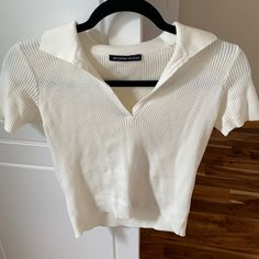 Never Worn Before Pretty White Color Comfortable White Collared Top For Day Out, Brandy White Top, White Collared T-shirt For Spring, Chic White Tops With Collared Neckline, White Collared Neckline Top For Day Out, Brandy Melville Button Up Top, Brandy Melville Basic Tops, Brandy Melville New York Shirt, Brandy Melville Shirts & Tops