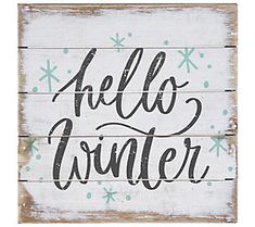 a wooden sign with the words hello winter written in black ink on white wood planks