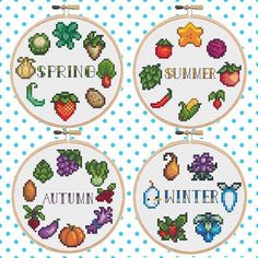 four cross stitch hoops with the words spring, summer and autumn