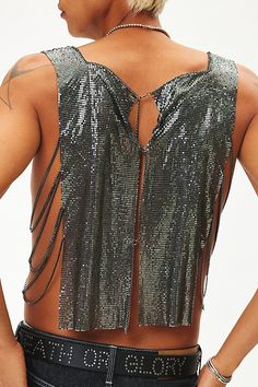 Troye metal tank top in a sleeveless style with an open back and cropped fit. Content + Care Mixed metals Wipe clean Imported Size + Fit S/M Dimensions Chest: 26" + 6" extender Length: 22" L/XL Dimensions Chest: 30.5" + 6" extender Length: 22.5" | Troye Metal Tank Top in Black, Men's at Urban Outfitters Cropped Party Vest Top, Edgy Backless Party Top, Silver Sleeveless Tank Top For Club, Party Vest Crop Top With Tank Straps, Party Crop Top With Tank Straps And Vest Detail, Edgy Crop Top Tank Top For Party, Edgy Backless Crop Top For Party, Metallic Crop Top For Summer Evenings, Metallic Crop Top For Evening In Summer