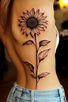 Sunflower tattoo on a person's side torso. Look Within Tattoo, Sunflower Stomach Tattoo, Sunflower Dandelion Tattoo, Sunshine Flower Tattoo, Sunflower Eye Tattoo, Sunflower Tattoo Abstract, Sunflower Tattoo Black Women, Sunflower And Wheat Tattoo, Knee Scar Tattoo Cover Up