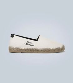 These canvas espadrilles from Saint Laurent are embroidered along the side with the brand's logo. Sporting classic jute trims and inscribed leather heel tabs, the design is complete with comfortable rubber soles..Upper: fabric.Toe shape: round toe.Sole: fabric insole, rubber sole.Made in Spain.Comes with a box.Designer color name: White.Lining: fabric.True to size.Half sizes please take the next size up.European sizes Classic Espadrilles With Contrast Sole For Spring, Classic Spring Espadrilles With Contrast Sole, White Canvas Espadrilles Casual Style, White Canvas Espadrilles With Woven Sole, White Canvas Espadrilles With Rubber Sole, White Espadrilles With Contrast Sole For Summer, White Closed Toe Canvas Espadrilles, Classic Closed Toe Espadrilles For Spring, Classic Spring Closed Toe Espadrilles