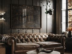 a living room with leather couches and a large painting on the wall above it