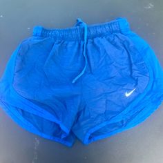 Blue Nike Dri Fit Shorts.. Size. Xs Nwot Nike Blue Sporty Shorts, Blue Sporty Athletic Shorts For Spring, Sporty Blue Athletic Shorts For Spring, Nike Blue Athletic Shorts For Spring, Blue Sports Shorts For Spring, Blue Nike Athletic Shorts, Nike Blue Workout Shorts, Blue Nike Athletic Shorts With Elastic Waistband, Nike Workout Bottoms In Blue