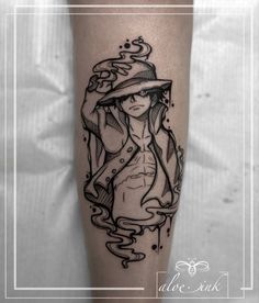 a woman with a hat on her head is depicted in this black and white tattoo