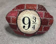 a red brick wall with the number nine painted on it