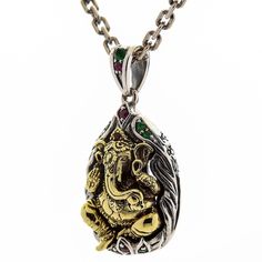 Sterling Silver Hindu Amulet Brass Ganesh Pendant New  made of durable 925 sterling silver and brass;   complemented with green, red, and pink CZ gems;   925 stamp is placed on the bail;  Pendant’s weight: 12 grams;   Dimensions: 22 mm x 40 mm (0.85” x 1.55”);  Hand-made pendant;  A necklace is not included.   They say that wise, kind, and good-natured Ganesha is able to remove any obstacle from your path thus helping you reach your goals faster and easier. If you believe in the power of this mi Traditional Jewelry For Good Luck And Festivals, Silver Gemstone Jewelry For Good Luck, Traditional Green Jewelry Stamped 925, Traditional Sterling Silver Jewelry For Good Luck, Ganesh Pendant, Ganesha Pendant, Skull Wedding, Dog Ring, Dragon Bracelet