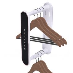 two wooden clothes hangers attached to the side of a white and black wall mounted device