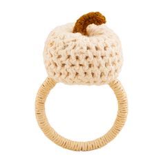 a crocheted ring with an apple on the top and a wooden bead in the middle