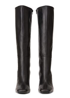 Lending a sleek aesthetic and modern vibes, the Havana knee-high boot is set to impress this AW22. Featuring a slender stiletto heel, an on-trend squared toe and a sleek fitted upper. As a zip-up boot, this style finishes just below the knee. Pair with tucked in pants or a midi-skirt for your next go-to. -Material: ALL NEW Leather Upper & Lining -Sole: Resin sole -Fit: Runs true to size -Toe-shape: Squared -Features: Inner matching zip -Heel: 10.5cm stiletto heel Leg Height x Calf Circumference Elegant Tall Heeled Boots For Workwear, Elegant Tall Heeled Boots For Work, Luxury Fitted Knee-high Boots For Work, Fitted Luxury Knee-high Boots For Work, Sleek Leather Over-the-knee Heeled Boots, Elegant Tall Knee-high Boots For Workwear, Luxury Fitted Square Toe Knee-high Boots, Leather Heeled Boots With High Shaft For Night Out, Chic Tall Leather Knee-high Boots