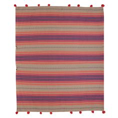 an orange, pink and purple striped rug with pom - poms on it