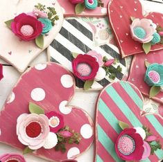 heart shaped cookies decorated with flowers and hearts