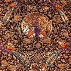 an intricately designed fabric with birds and flowers