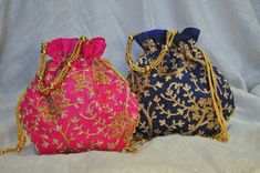 Ready to ship from USA! The list price is for ONE embroidered bag in your choice of color. Drawstring open and close. Big enough to fit an Iphone. These bags are made with high quality luxurious silk satin fabric. They are embroidered with gold thread.  Each bag has multi strand gold beaded handle.  The drawstrings are detailed with gold beads.  All the bags are fully lined with matching silk satin fabric.  Truly unique potali bags!!  These bags can be used for many things: --- Diwali party favo Traditional Blue Bags Suitable For Gifts, Gold Embroidered Pouch For Gift, Gold Embroidered Bags For Gifts, Traditional Multicolor Embroidered Pouch For Gifts, Traditional Multicolor Embroidered Pouch As Gift, Embroidered Clutch Potli Bag Gift, Multicolor Embroidered Bag For Festival Gifts, Multicolor Embroidered Bag For Festivals, Blue Embroidered Bag As A Gift