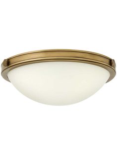 a flush light fixture in an antique brass finish