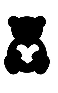 a black and white silhouette of a teddy bear holding a heart