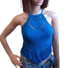 "Are you looking for the perfect way to spice up your wardrobe? Look no further - the heart shaped fringe top top is just what you need! This eye-catching lace crochet backless top  has a chic yet playful look that will instantly add a fashionable flair to your style.  Crafted from soft and breathable cotton/acrylic yarn , this Blue boho crop top is designed to fit comfortably and flatter your figure. Plus, the lightweight material ensures you stay cool and comfortable even in the hottest weathe Purple Rave Outfit, Crop Top Knit, Chic Tank Tops, Boho Crop Top, Boho Crop Tops, Crochet Fringe, Womens Halter Tops, Fringe Top, Backless Top