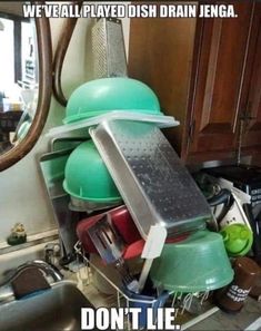 a kitchen sink filled with lots of clutter