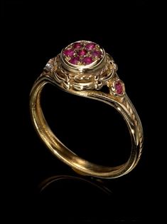 Unique victorian antique style 14K ring with 9 small canter ruby stones. Vintage ring. Top width : 1cm. *14K Solid Gold, we don't offer any plated or gold filled jewellery at all. Free Shipping for all orders . I offer a lifetime craftsmanship warranty on all of my jewellery. I resize all rings for life free of charge. Victorian Ruby Ring With Center Stone, Yellow Gold Ruby Ring With Intricate Design For Promise, Victorian Ruby Ring In Yellow Gold With Intricate Design, Victorian Yellow Gold Ruby Ring With Intricate Design, Victorian Ruby Ring For Wedding, Victorian Style Ruby Ring For Wedding, 14k Yellow Gold Ruby Ring With Intricate Design, Victorian Style Ruby Wedding Ring, Antique Ruby Ring With Rose Cut Diamonds