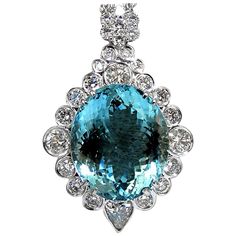 Investor Beauty by Avis Diamond. GIA 29.24 "Blue" Aquamarine & Diamonds necklace. Oval and Full cut Vibrant Blue Aqua color 22.53 X 19.15 X 11.99mm Report #2165980504 4.47ct. Diamonds. Pear & Rounds Full cut brilliants Vs-2 clarity G-color. Overall pendant: 1.8 X 1.2 Inch Depth: .60 inch. 17 3/4 inches necklace to accompany (as shown) 6 stranded. 14Kt white gold. Grand weight: 28 grams Appraisal will accompany for: $50,000 Yellow Diamond Necklace, Art Deco Pendant Necklace, Diamond Flower Pendant, Art Nouveau Pendant, Diamonds Necklace, Aquamarine Pendant, Aquamarine Engagement Ring, Antique Pendant, Gold Pearl Necklace