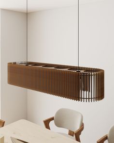 a wooden light fixture hanging over a dining room table