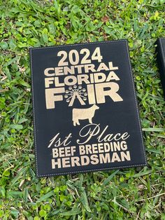 two book covers laying in the grass on top of each other with words reading, 2012 central florida fair and 1st place beef breeding