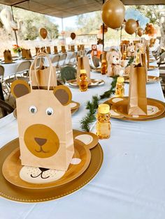 there is a paper bag with a bear on it sitting on the table in front of other items