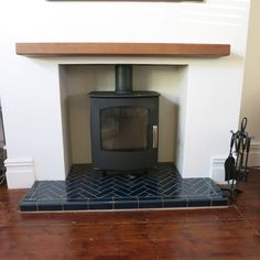 a wood burning stove sitting inside of a living room