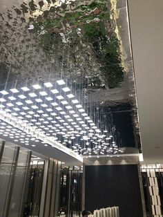 the ceiling is covered with many lights and mirrors