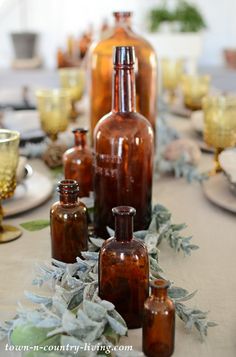 several brown glass bottles sitting on top of a table