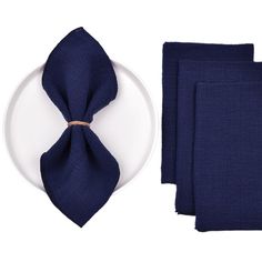 the napkins are folded and ready to be placed on top of each other, along with an empty plate