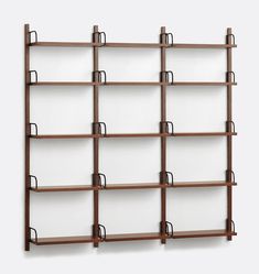 a wooden book shelf with several shelves on each side and two black clips hanging from the top