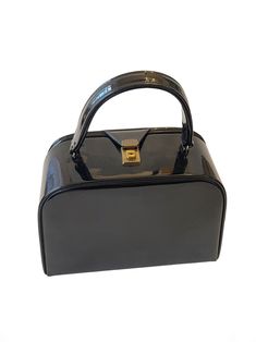 a black handbag with gold hardwares on the handle