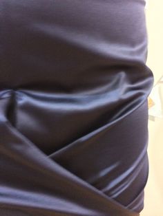 This gorgeous deep purple satin skirt is a piece of art. The fabric is like butter and the zipper on the rear fits perfectly on your curves. We love the gathering at the front to show off your figure. You'll feel like you can take on the world in this sexy skirt. Skirt features logo embossed zipper. Designer: Burberry Size: 6 30" waist 35" hips 19" front 23" back Material Outer: 58% Polyester, 47% Cotton Lining: 100% Cupro Care: Dry Clean or Hand wash Wash, line dry, and steam Condition: Like New (Condition Guide) Retail $1159 Product From Canada, Made in Italy ♥ Sustainable + Ethical Satin Skirt With Ruched Detail For Night Out, Satin Ruched Skirt For Night Out, Ruched Satin Skirt For Night Out, Fitted Draped Satin Skirt, Fitted Silk Skirt With Folds, Fitted Silk Skirt With Ruched Detail, Ruched Stretch Skirt For Formal Occasions, Evening Satin Skirt With Stretch, Stretch Satin Skirt For Evening