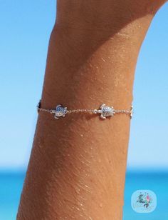 If you love turtles as much as we do you will love our Honu Lagoon bracelet! Ocean inspired & water safe, what more could you want! If you love spending your days by the ocean but hate always having to take off your jewellery to swim, you need our jewellery! Our Honu Lagoon bracelet can be worn on all your salty adventures. Adjustable chain - adjust this bracelet to fit you Made with sterling silver & 18k gold vermeil - will never turn your skin green or tarnish Packaged in a gorgeous shell jewe Adjustable Ocean-inspired Jewelry For Everyday, Everyday Adjustable Ocean-inspired Jewelry, Adjustable Ocean-inspired Everyday Jewelry, Dainty Resizable Jewelry For Beach, Silver Strand Bracelets As Gift, Nickel-free Bracelets For Beach, Silver Vacation Bracelet, Resizable Jewelry Bracelet For Vacation, Adjustable Strand Jewelry Gift