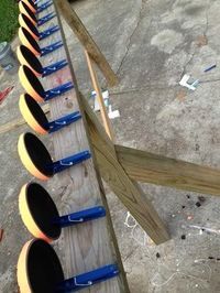 a row of traffic lights sitting on top of a wooden pole