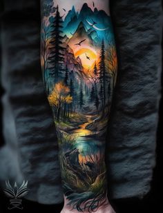 a man's arm with an image of mountains and trees on it