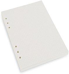 a white notebook with holes on the cover