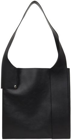 Grained leather tote in black. · Logo-embossed fixed shoulder strap · Two-compartment interior · Central zip pocket · Unlined · Silver-tone hardware · H10 x W10 x D1.5 · Total height: H21 Part of the A.P.C. x Natacha Ramsay-Levi collaboration. Supplier color: Black Black Logo, A P, Leather Tote, Apparel Accessories, Zip Pockets, Silver Tone, Shoulder Strap, Shoe Bag, Outfit Accessories